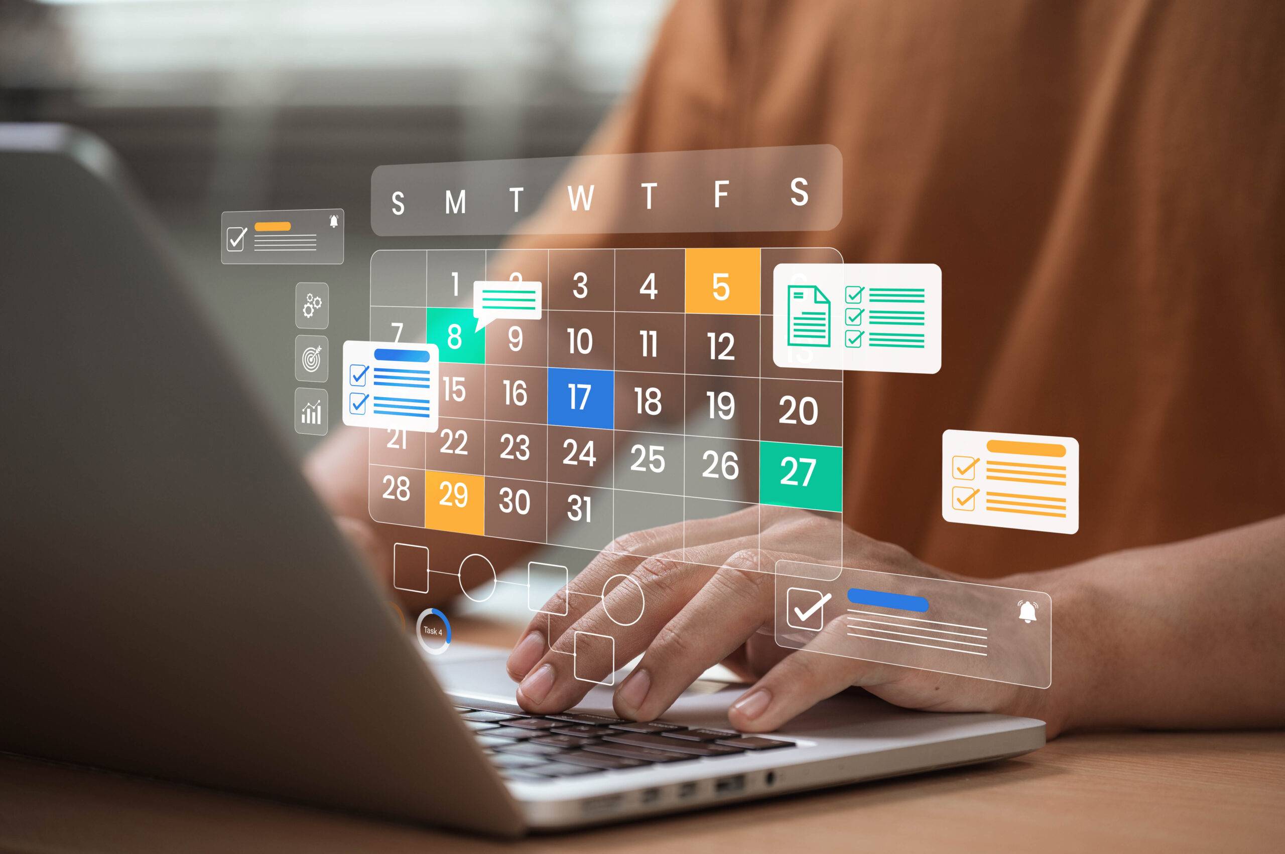 House manager managing a digital calendar on a laptop, representing household scheduling and daily operations coordination.