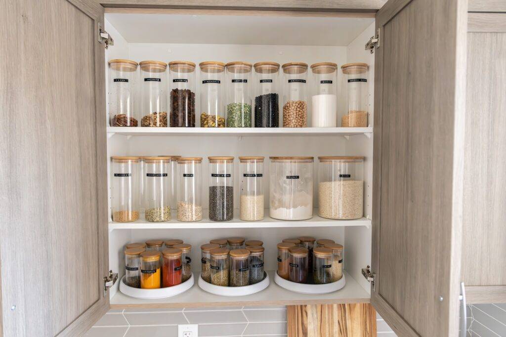 Household assistant organizing a pantry for a busy family