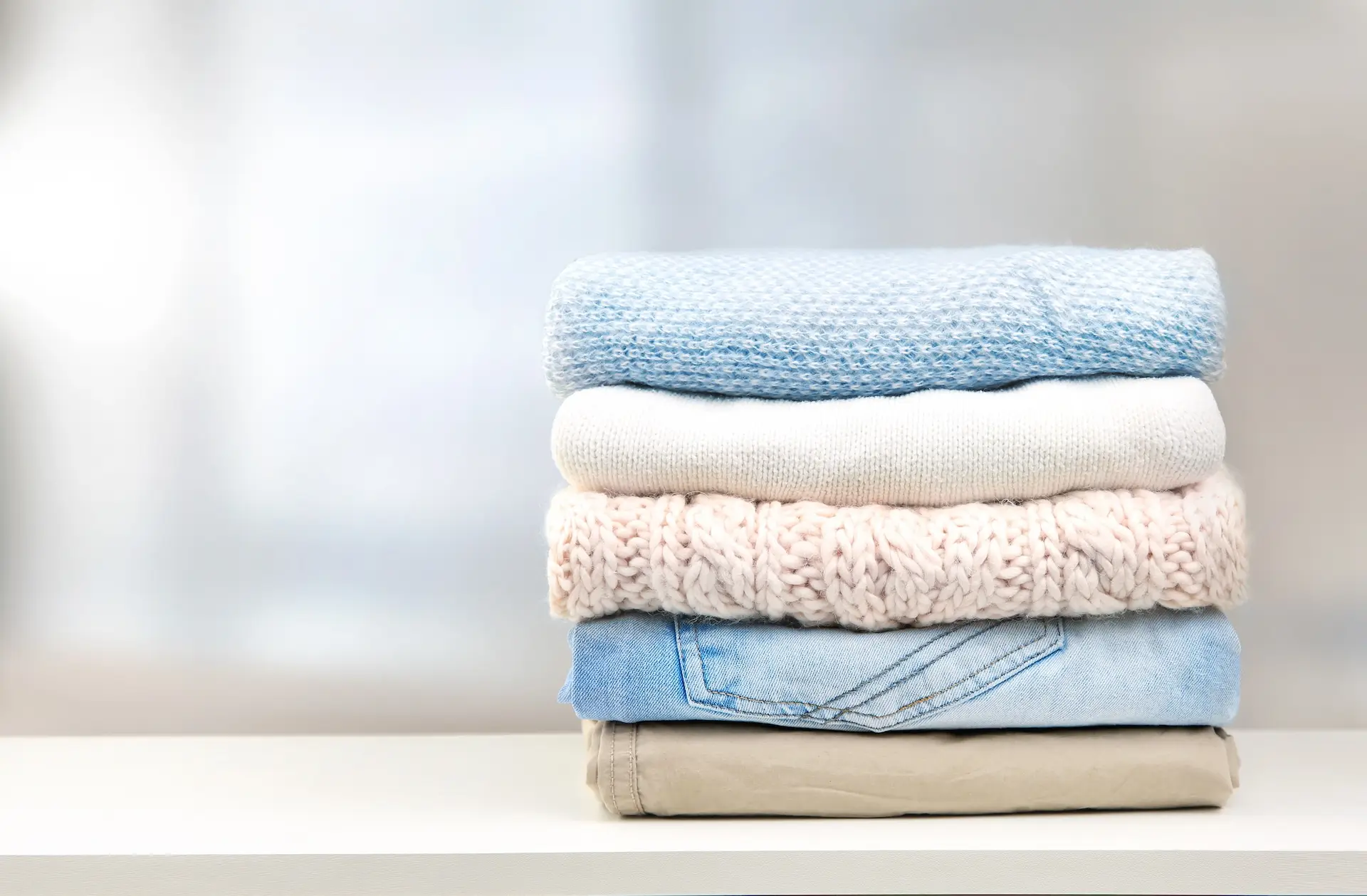 family assistant folding laundry